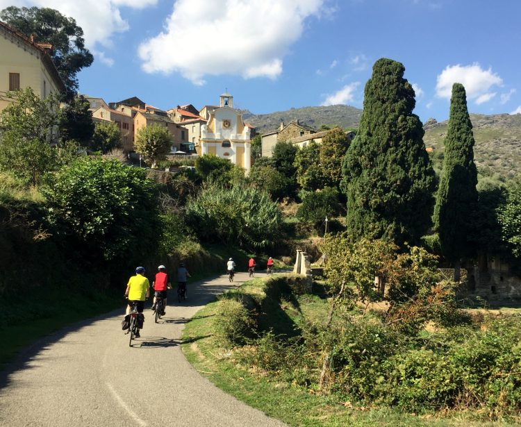 Cyclists in mountain village on Corsica